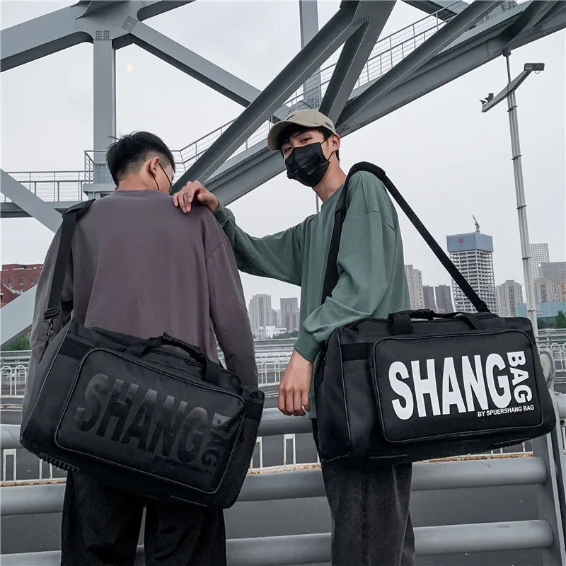 Two people carrying black 'SHANG' bags with a cityscape in the background