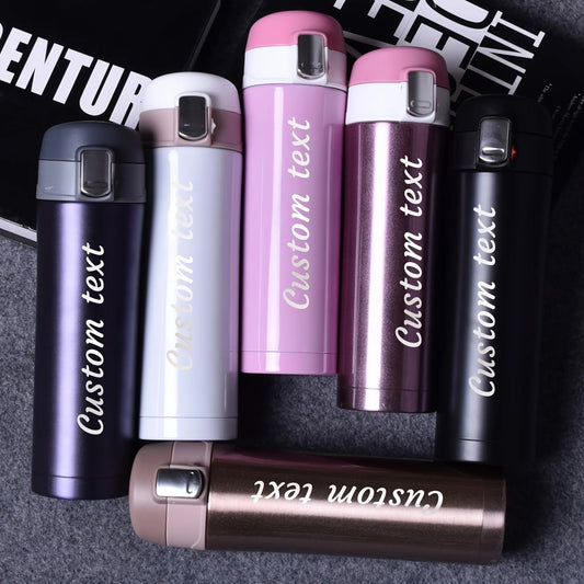 Set of personalized lighters with 'Custom text' engraved on them, displayed against a dark background.