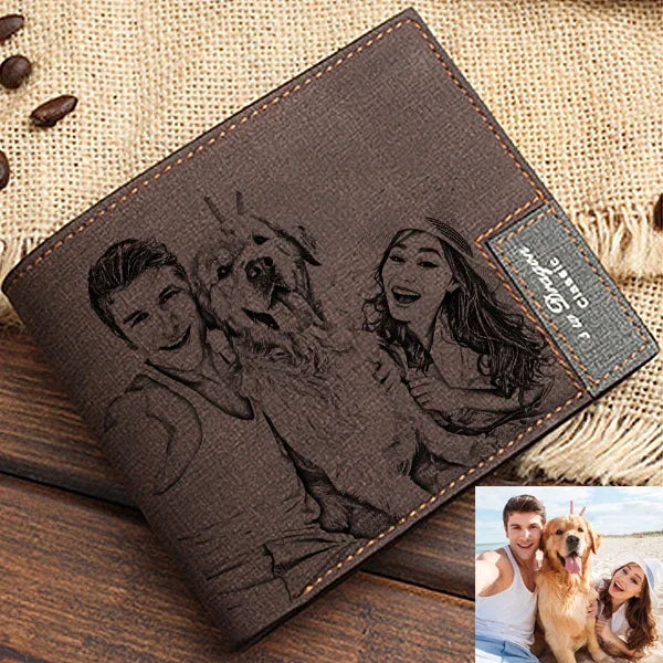 Brown leather wallet with engraved portraits of a couple and their dog, placed on a textured surface.