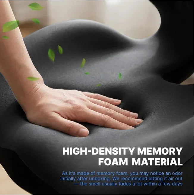 Hand resting on a high-density memory foam seat cushion with green leaves.
