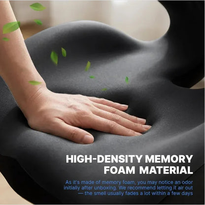 Hand resting on a high-density memory foam seat cushion with green leaves.