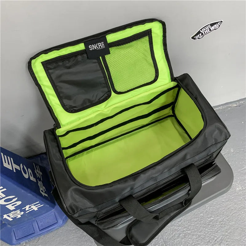 Open black and green bag with visible brand logo on a gray background