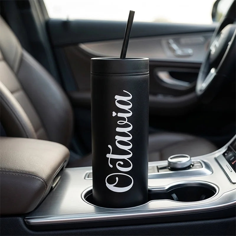 Black tumbler with 'Octavia' on a car cup holder