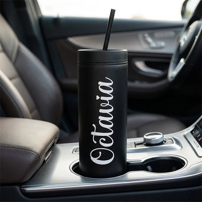 Black tumbler with 'Octavia' on a car cup holder