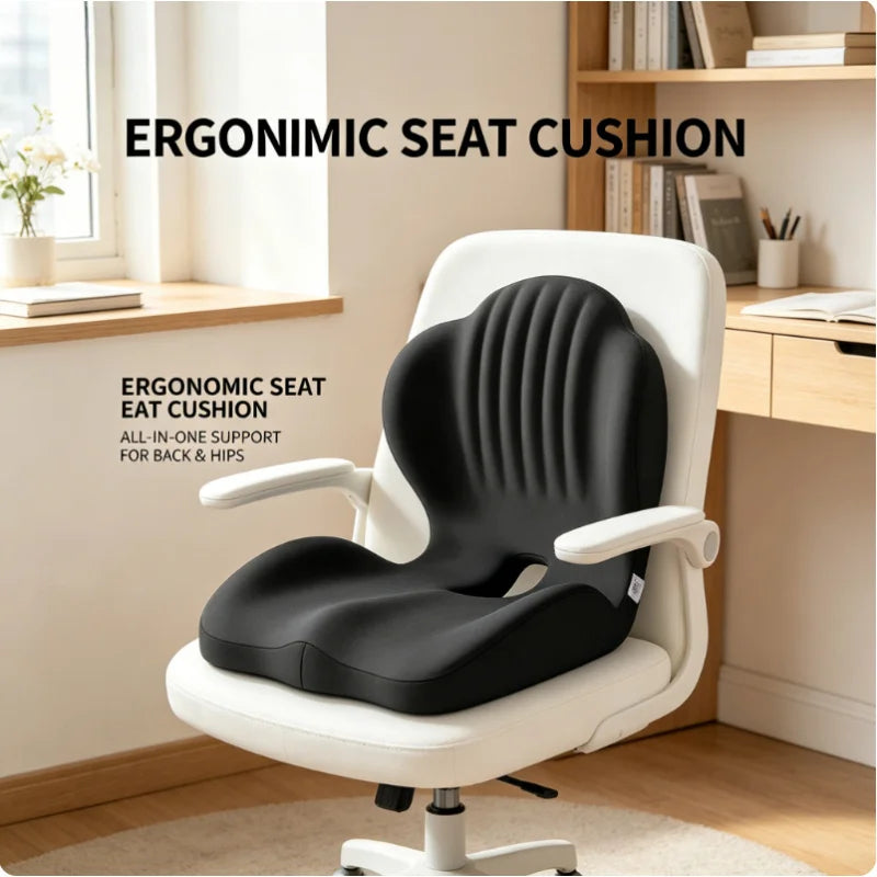 A black ergonomic seat and back cushion installed on a white office chair in a bright home office setting, with text overlays describing the product.