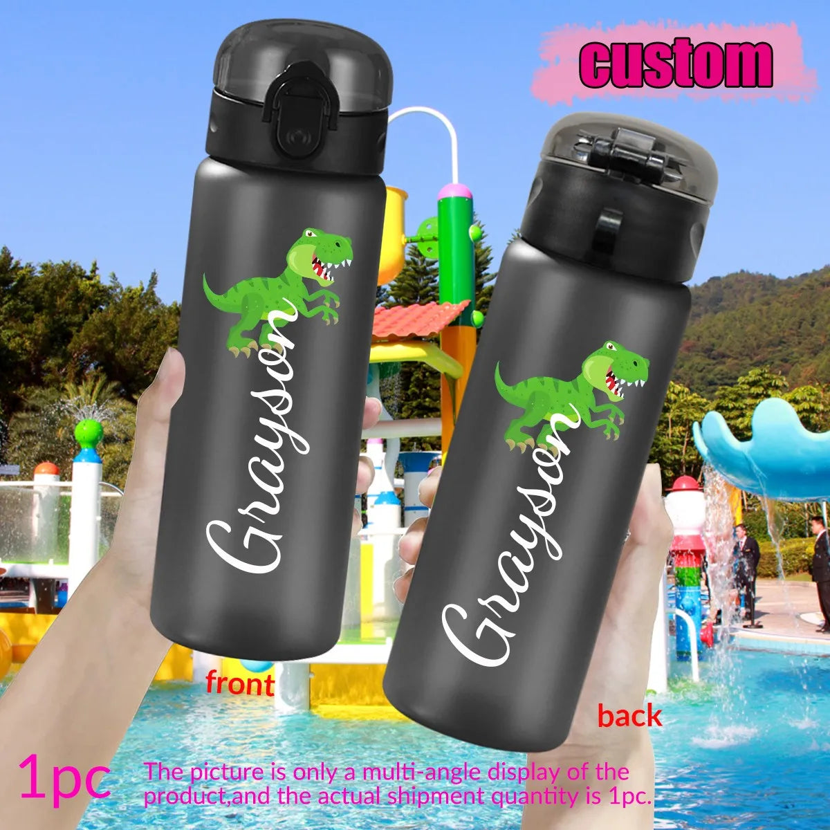 Black water bottles with a dinosaur design and 'Grayson' text, held in front of a water park.